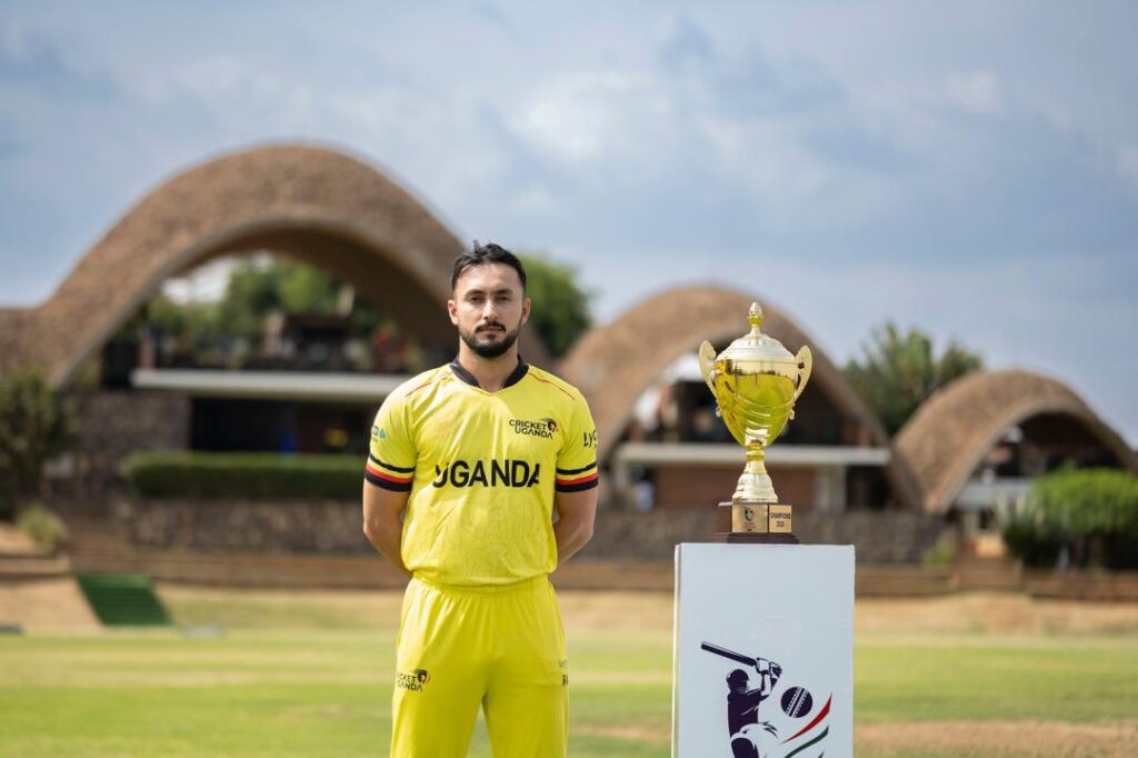 Cricket Cranes captain Riazat Ali Shah poses beside the Continent Cup trophy ahead of Uganda’s campaign in Kigali.
