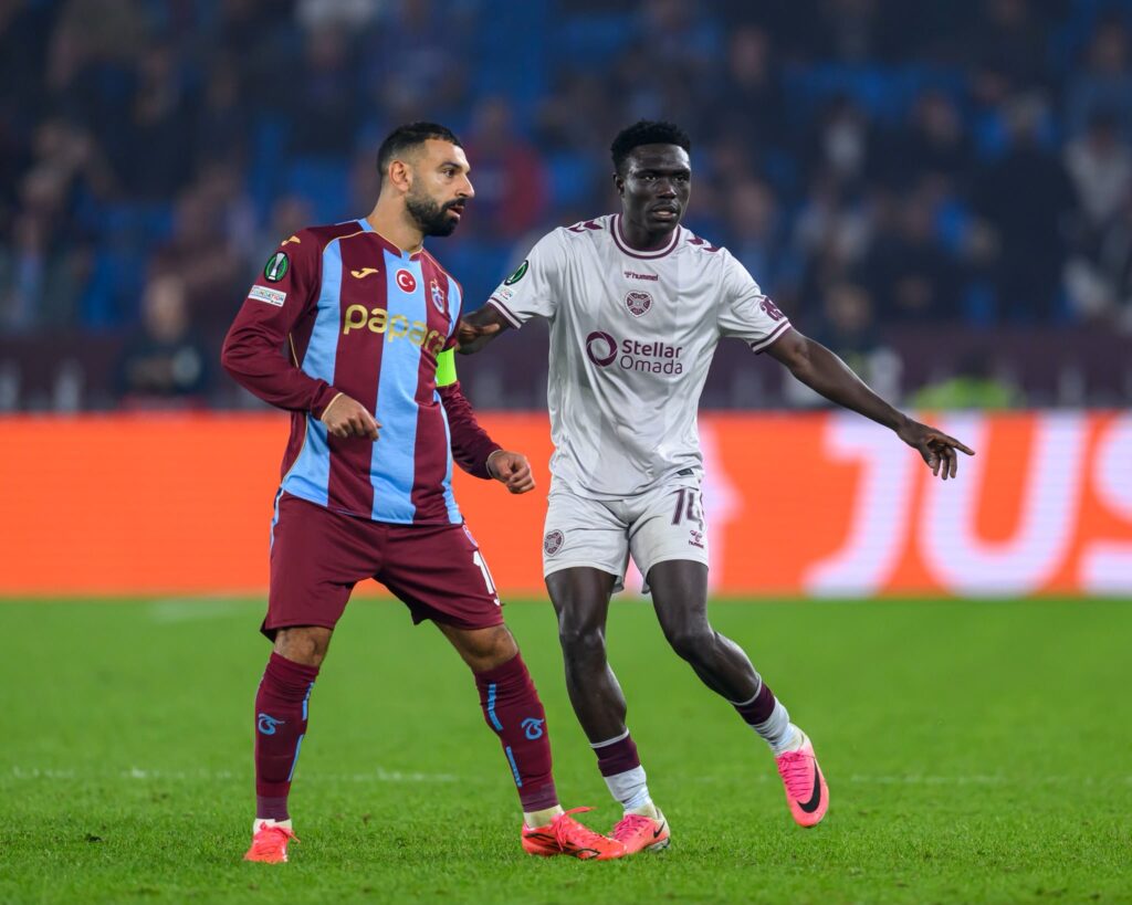 Hearts’ Rogers Mato alongside Trabzonspor’s Mohamed Salah