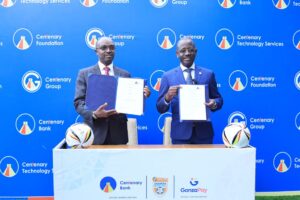 UPL board chairman Arinaitwe Rugyendo and Centenary Bank managing director Godfrey Byekwaso at the Shs204m partnership signing in Kampala.