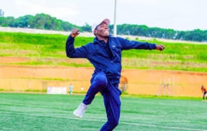 Ugandan football coach Jackson Mayanja celebrates on the touchline during his coaching career in Rwanda.