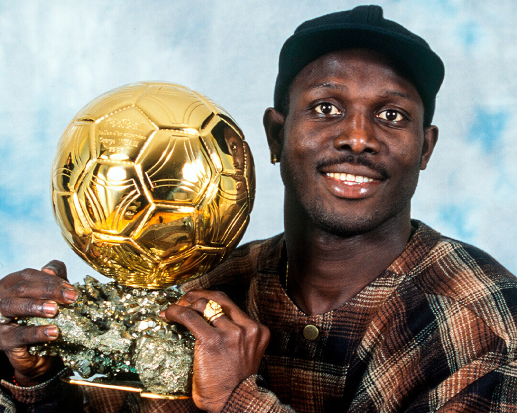 George Weah poses with his Ballon d’Or trophy, which he won in 1995.